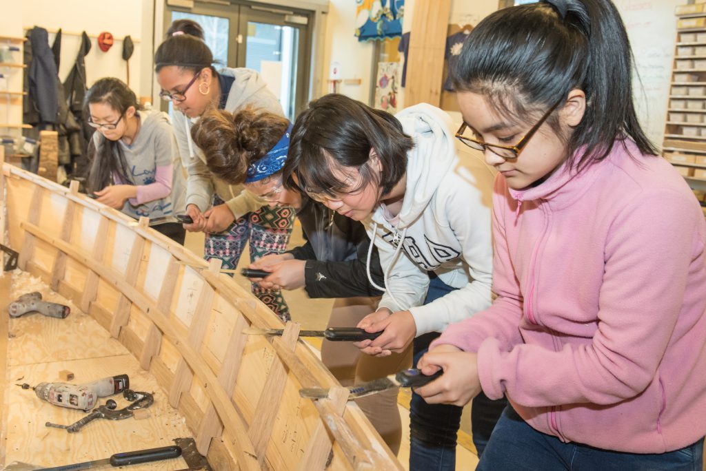 Children build a boat