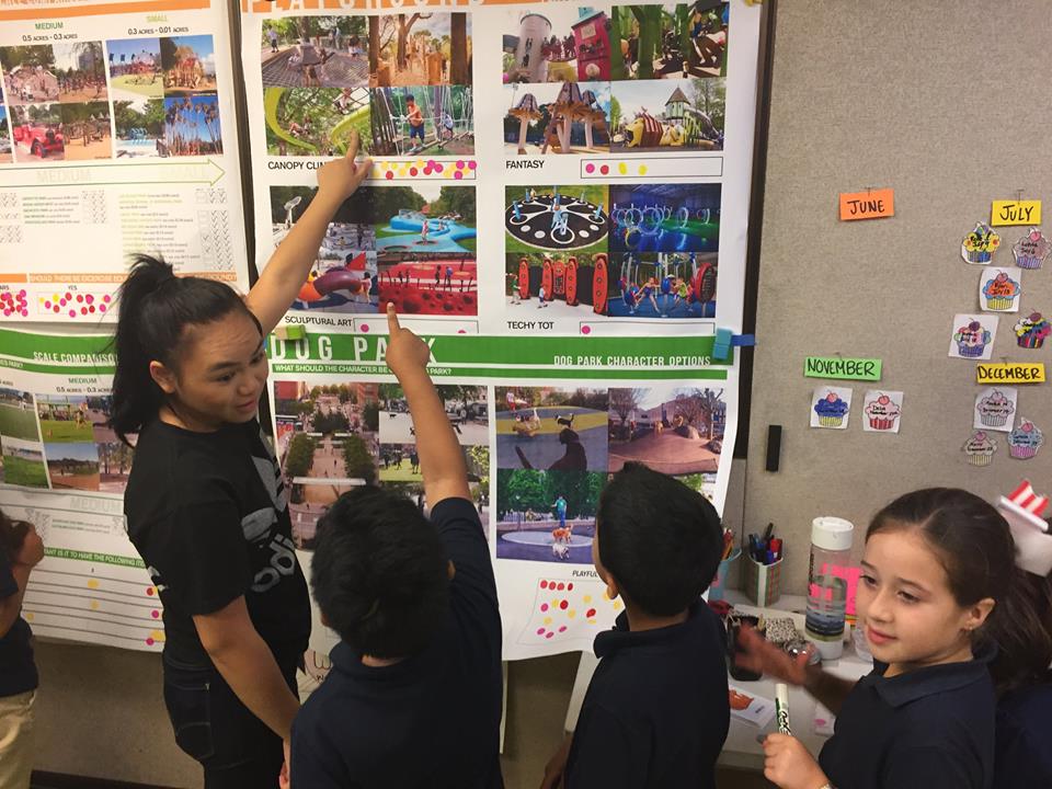 Children at Third Street Community Center play an interactive wall game