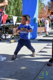 Young Asian boy walking to raise money