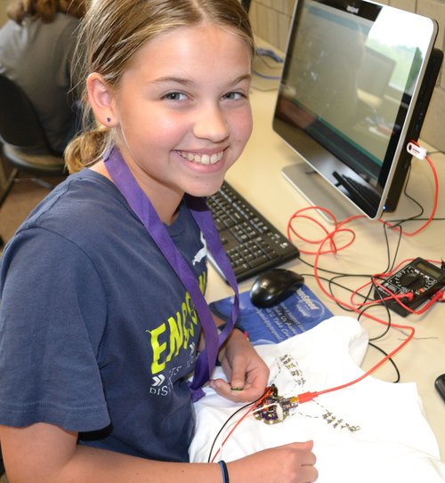 Girl happy to be working in technology