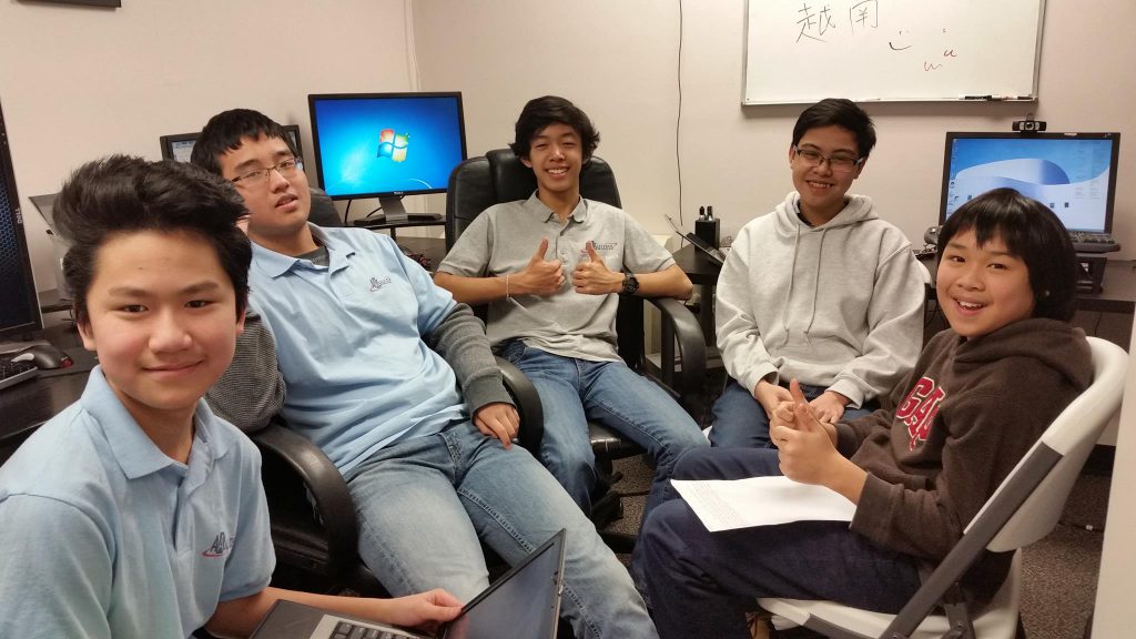 Young Asian boys take computer course