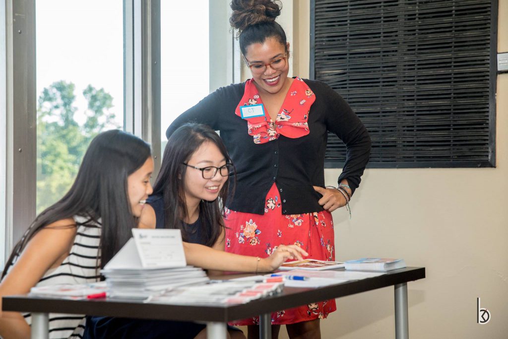 Young Asian women working with mentor