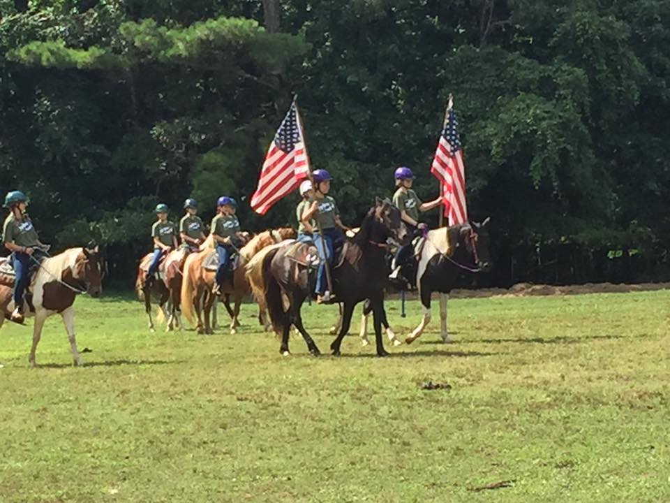 Girl Scout flag ceremony on horseback