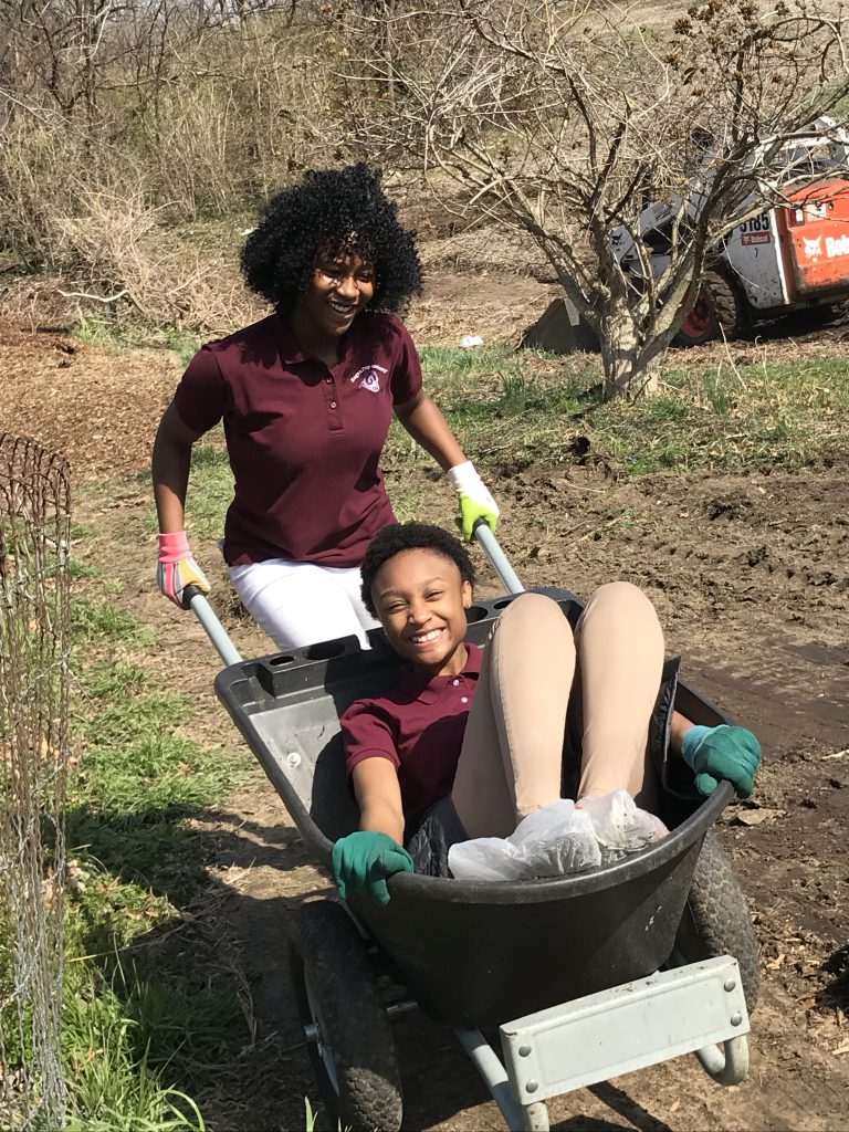 Green Works kids enjoying themselves while working on an environmental program