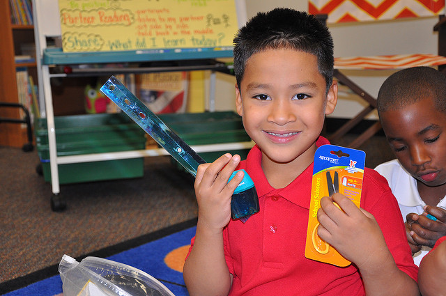 Shy boy receives school supplies