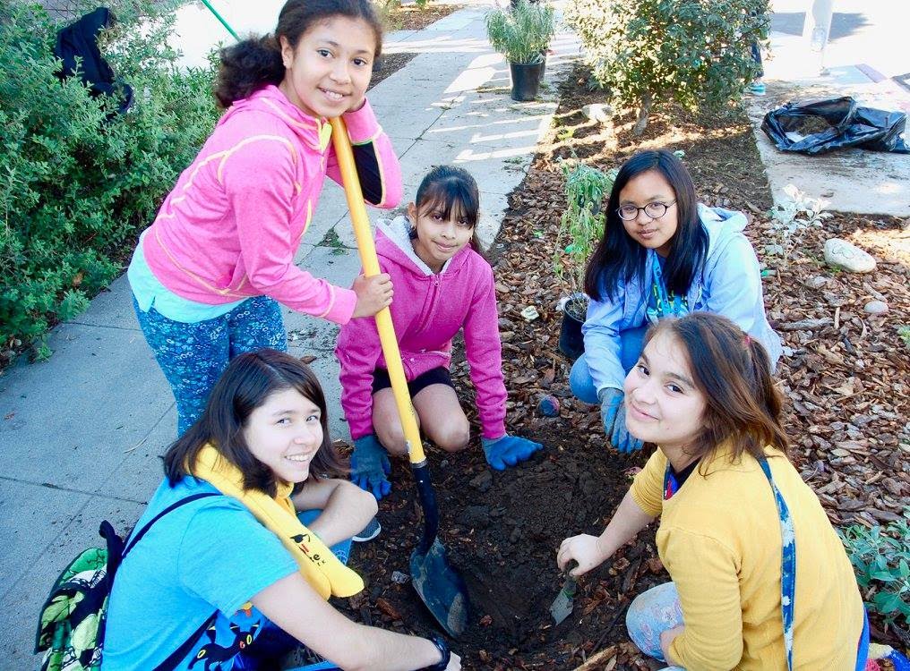 Young ECS Students Dig in garden