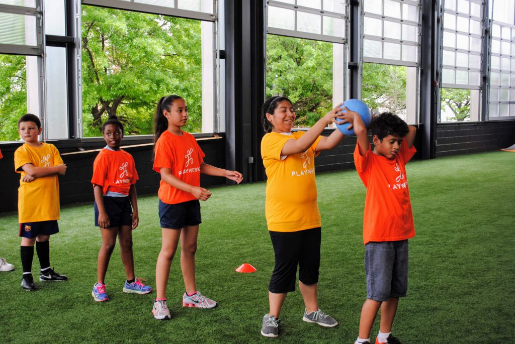 Kids successfully play a game, thanks to Playworks