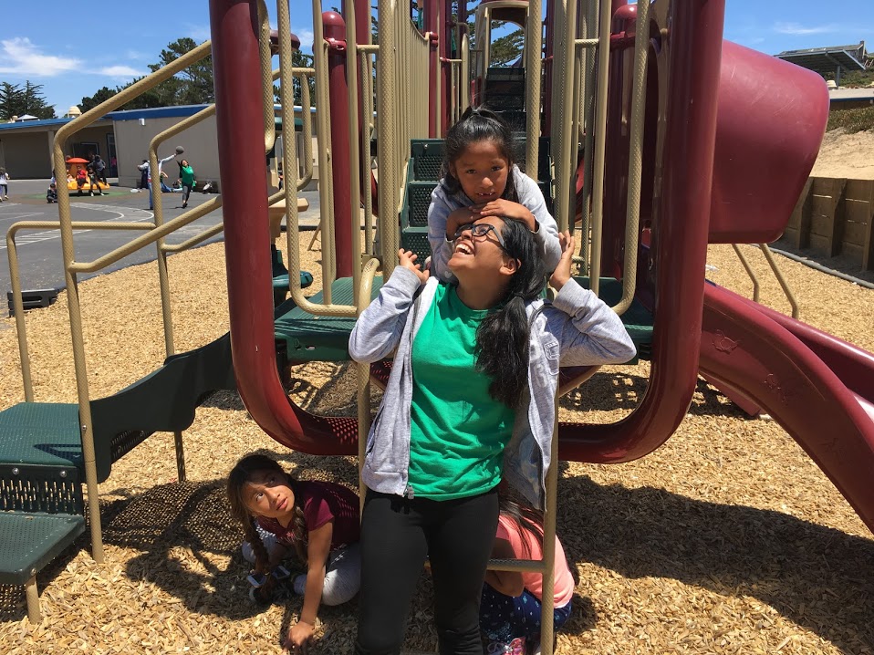 CPY mentor with young charge at school playground