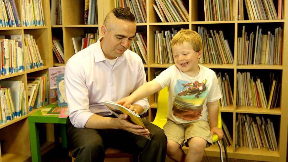 Mac and Jose read a book together