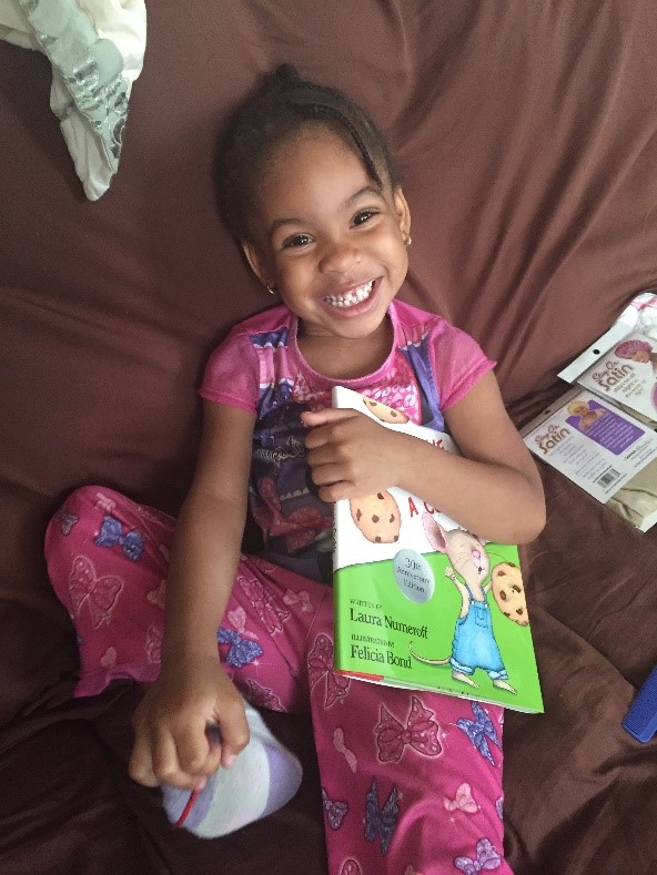 Smiling Girl with Book (Parent-Child Home Program)