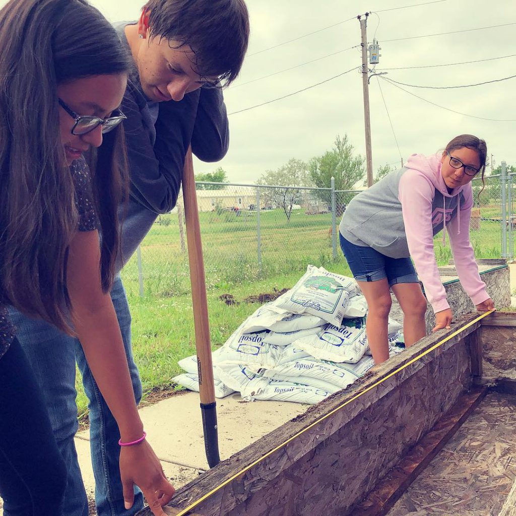 Lower Brule Research participants build a raised bed