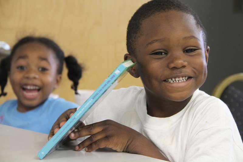 Freedom Readers small boy participant smiles