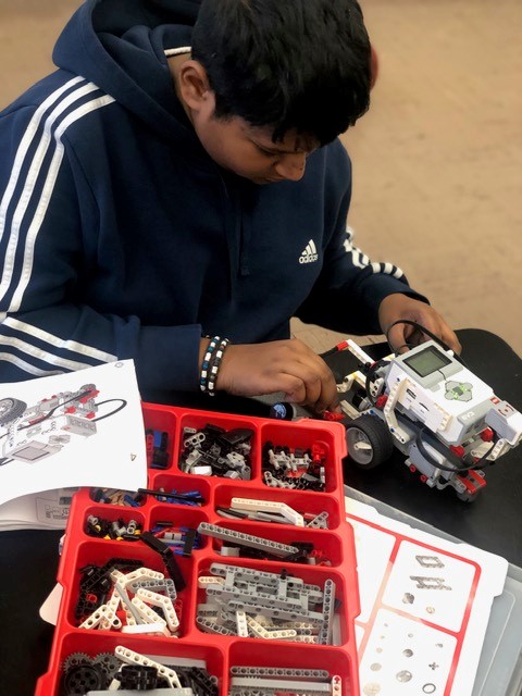 Young man learns about robotics at Elite Learners Inc