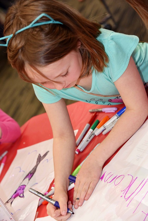 Raising Kindness participant concentrates on her project