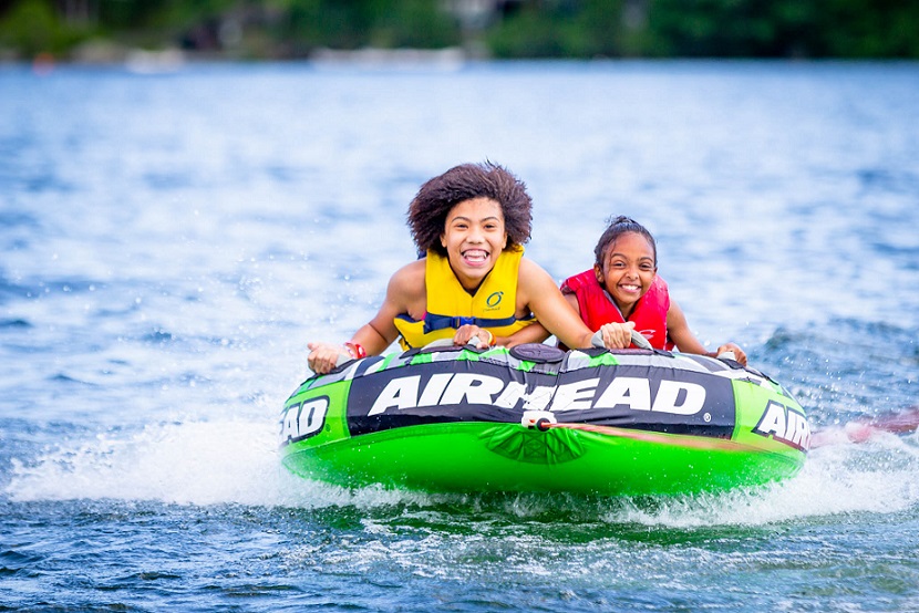 Campers in a boat at West End House Girls Camp