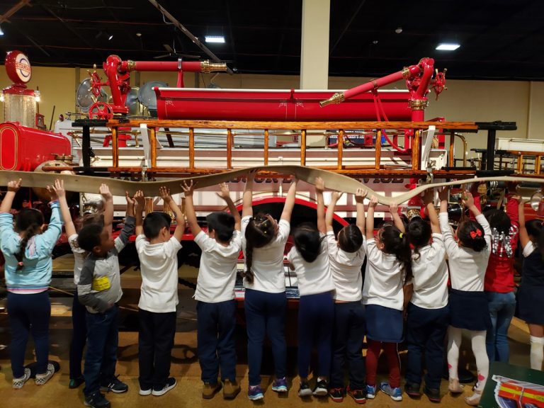 Highlandtown Elementary schoolchildren raise a fire hose