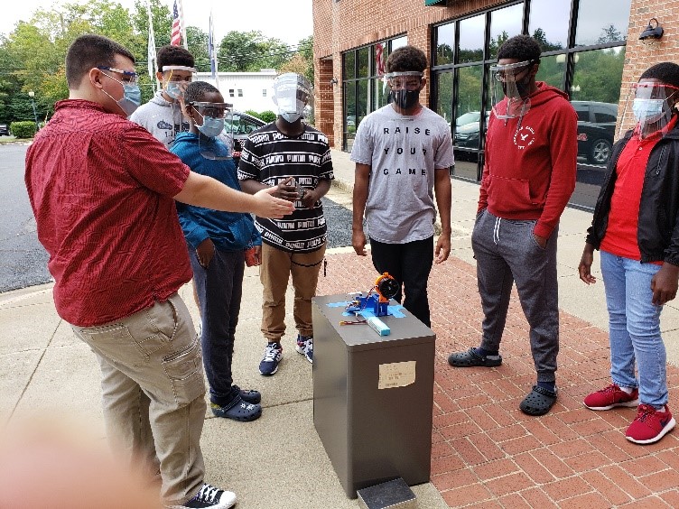 Future Kings participants with the model they built of a jet engine