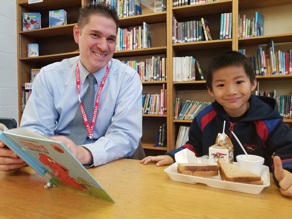 Inspiring Minds volunteer and student participate in the Power Lunch program