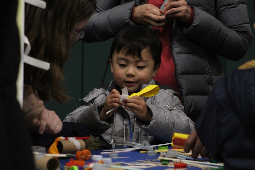 Young Asian boy learns the rudiments of engineering