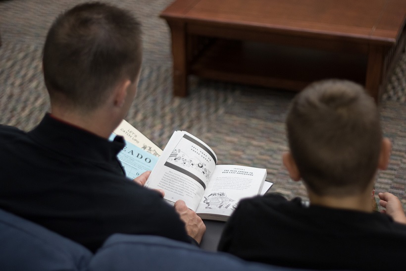 Everybody wins iowa mentor reads to young boy