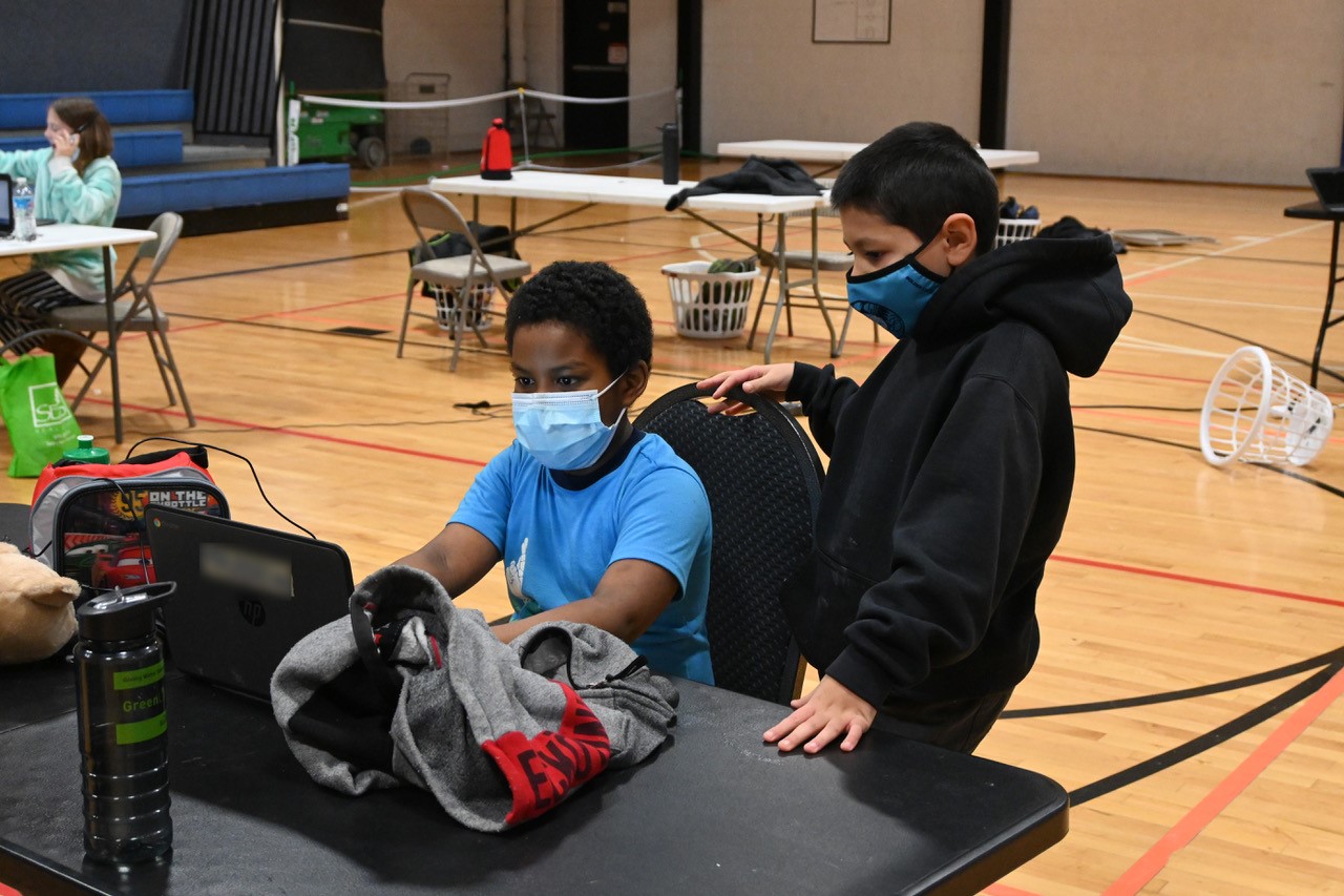 Kids do schoolwork at the Y