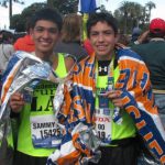Two smiling teenage boys after finishing marathon