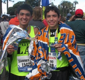 Two smiling teenage boys after finishing marathon