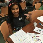 Young girl learns sign language