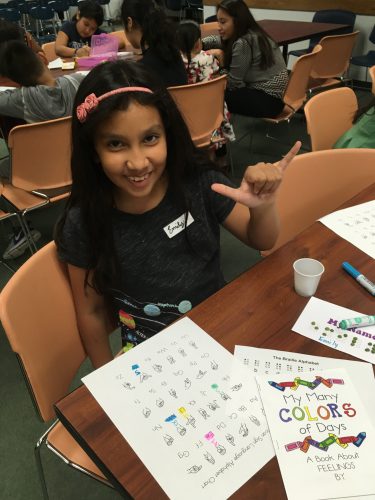 Young girl learns sign language