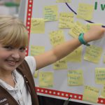 Smiling blond Brownie Points to chart