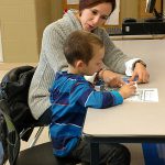 Partners in Education tutor and little boy study