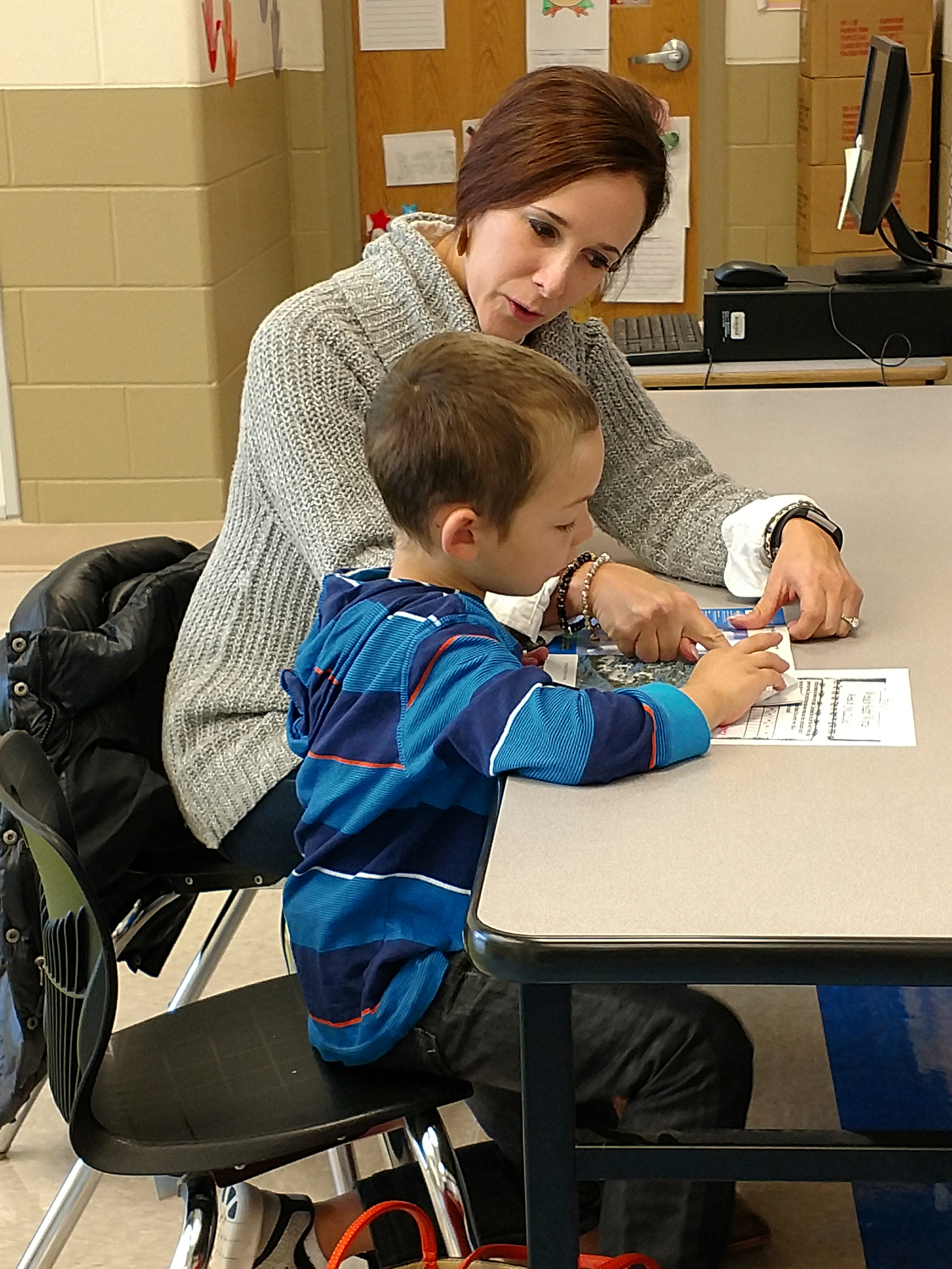 Partners in Education tutor and little boy study