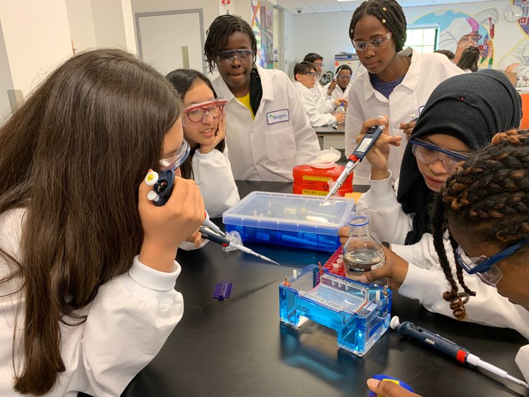 Enroot students conducting experiments at the Biogen Community Lab