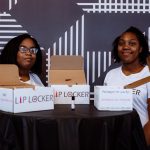 two proud Gray Matter participants display their business products