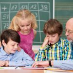 Senior reads to children in the classroom