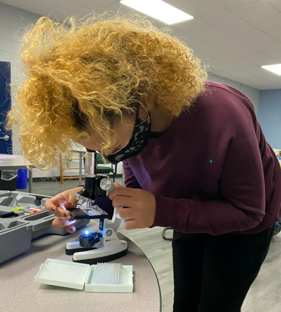 Aliah with Microscope