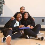 Happy trio of Youth Enrichment Services (YES) youth