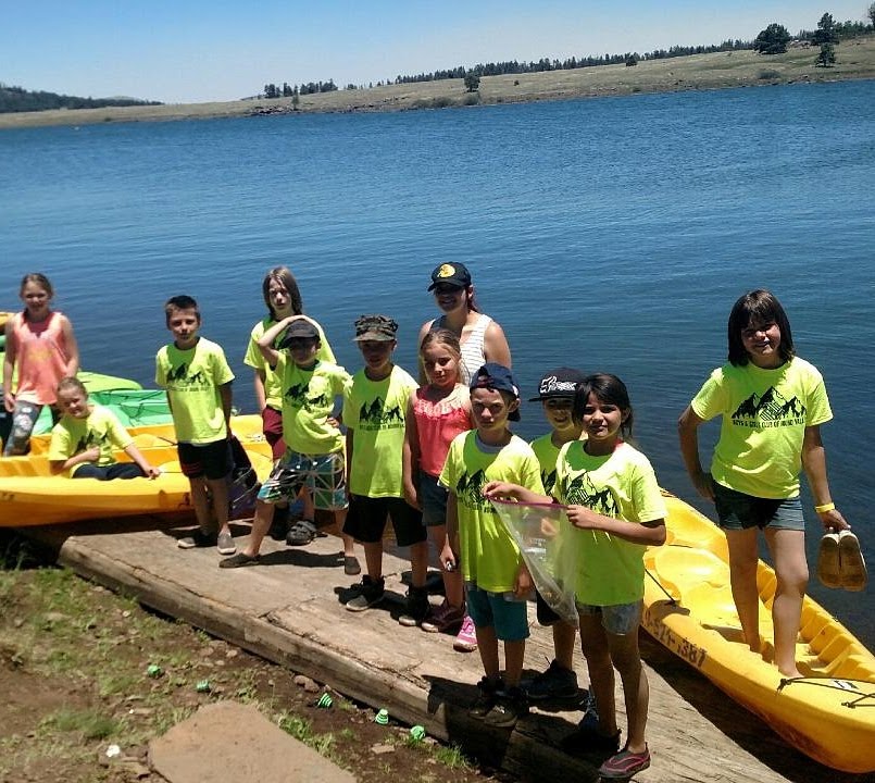 Young Arizona Outdoor Adventures participants getting ready for a group canoeing expedition