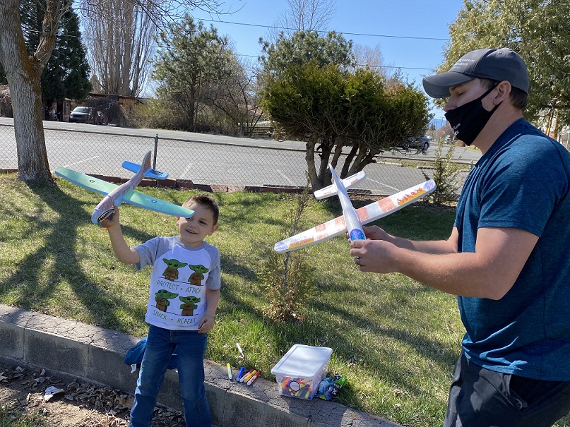 Friends of the Children--Klamath Basin mentor and mentee fly airplanes they made from a kit