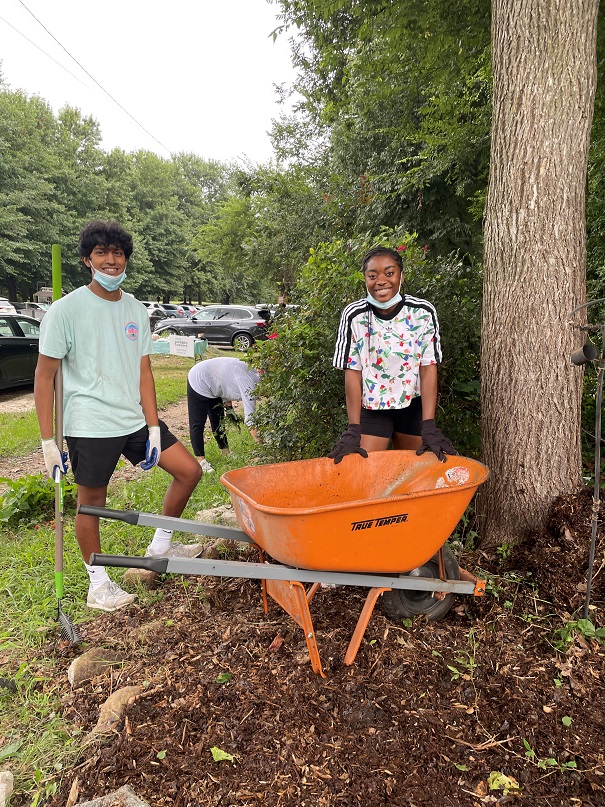 Pebble Tossers engage in some community beautification, A/K/A weeding public spaces.