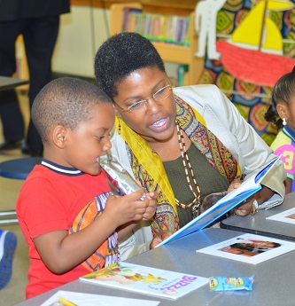 African American woman teaches little boy to read, Everybody Wins! Atlanta
