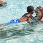 Teaching a camper to swim at Camp Horizon