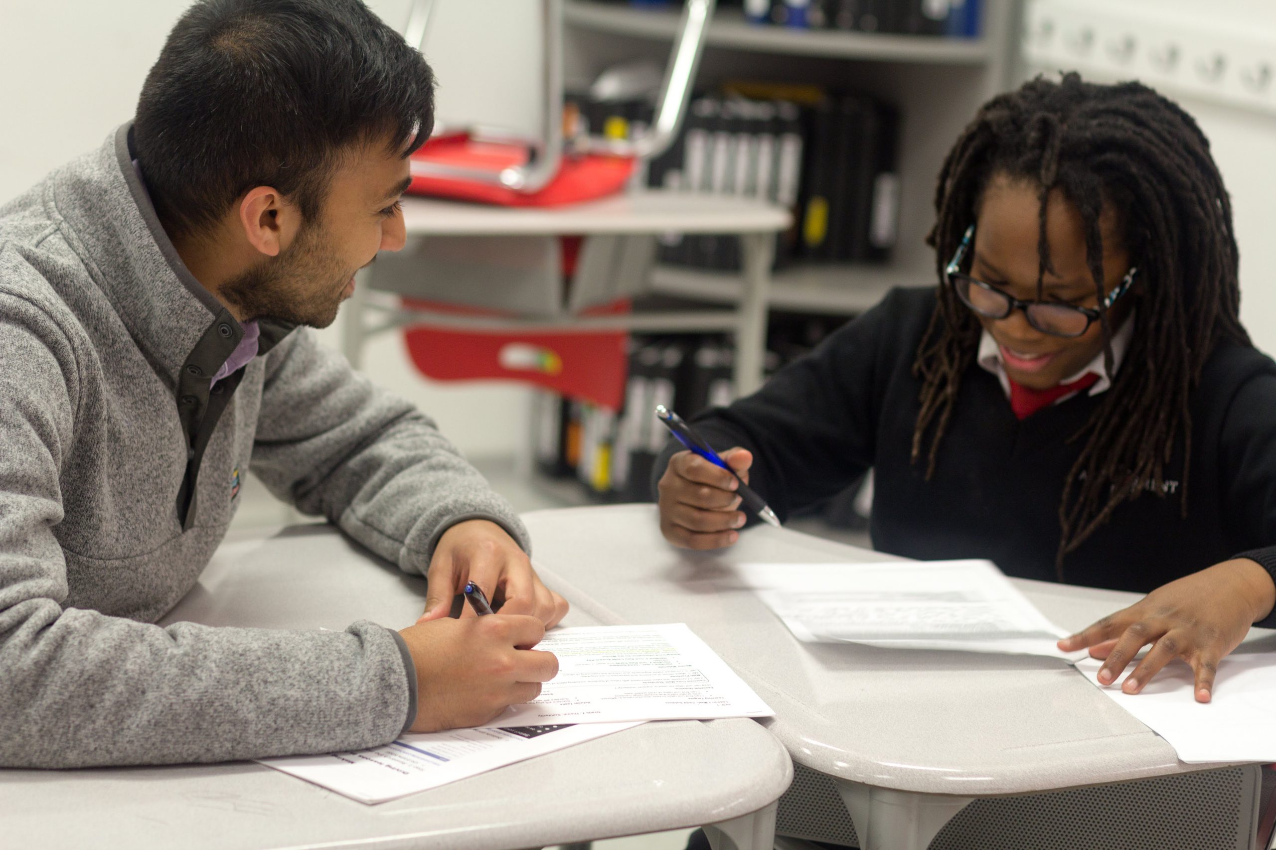 tutor works with higher achievement scholar