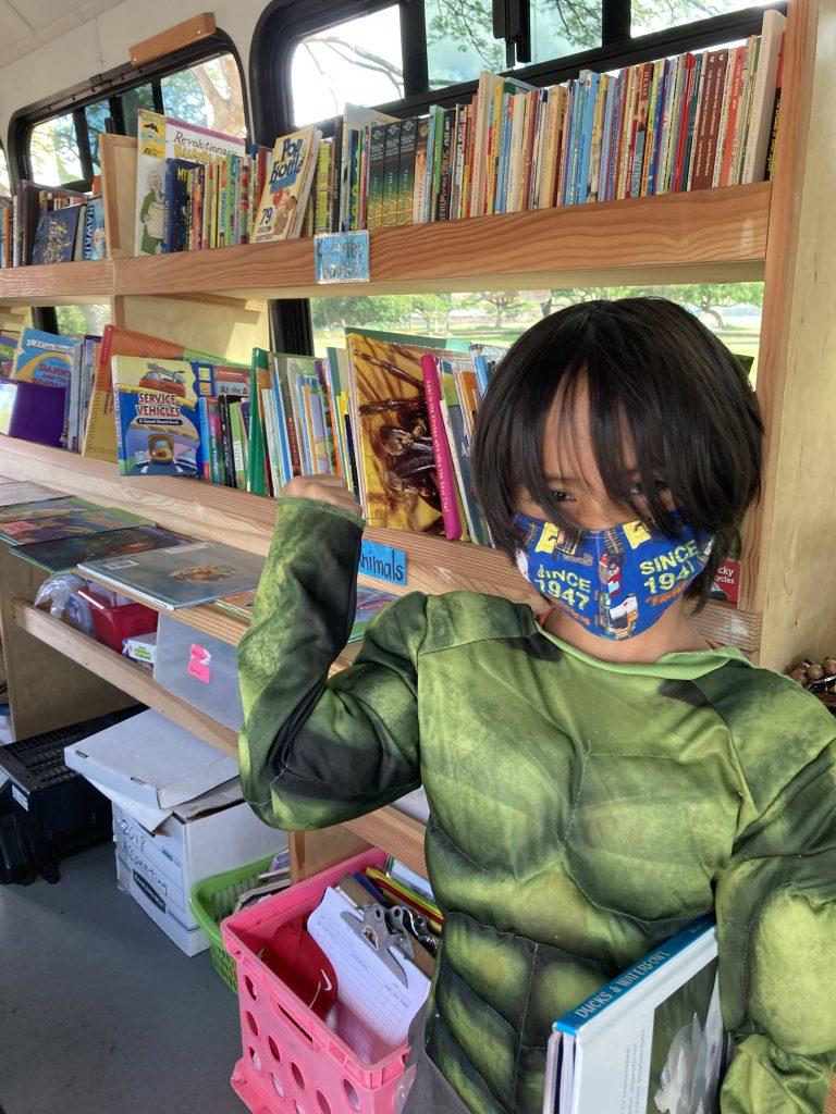 boy in mutant ninja turtle costume in the Hawaii Literacy library