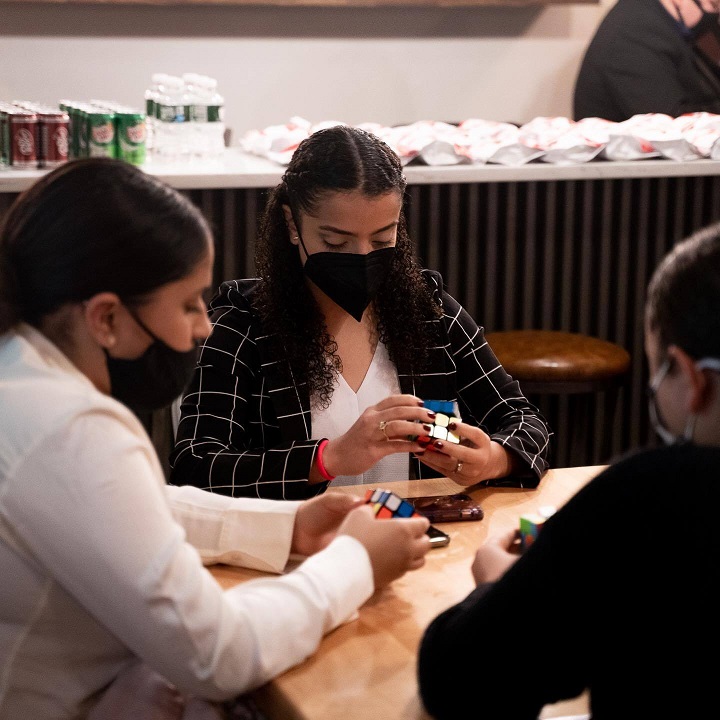 Attollo students do Rubiks cube during mental exercise