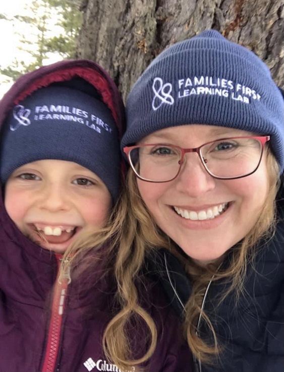 Smiling mother and child where Families First watch caps