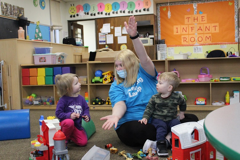 Preschool children and teacher at The Learning Lamp