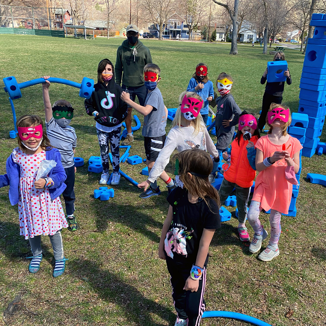 Outdoor group photo of costumed children at Families First