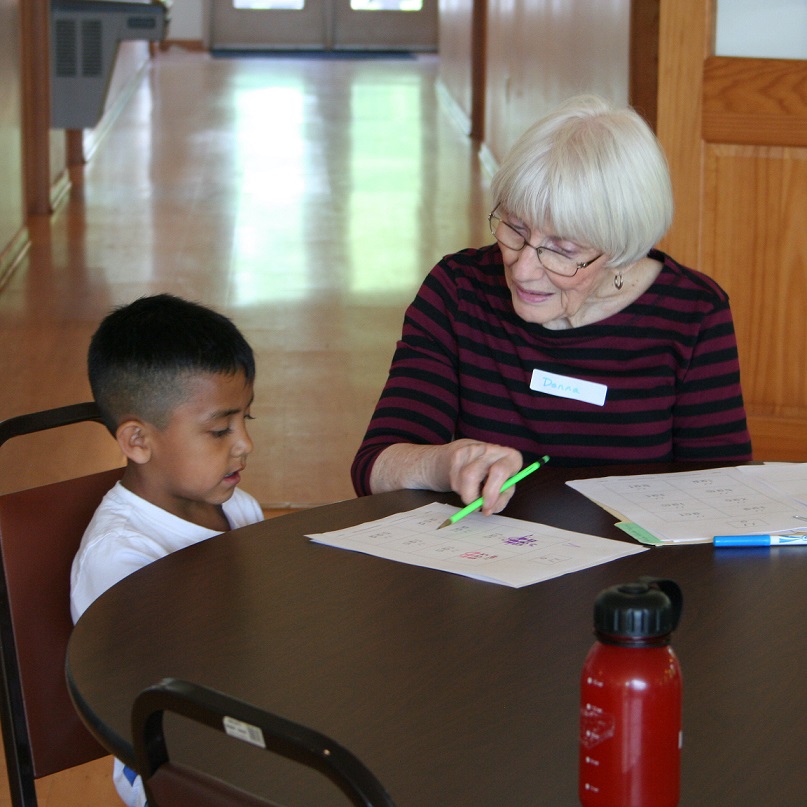 A Kids Ranch Inc. volunteer tutor works with student