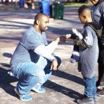 Travis Manion Foundation does hand puppetry with youngster